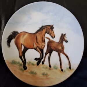 Two majestic horses run side-by-side in this artwork from a Driftwood Art Society artist